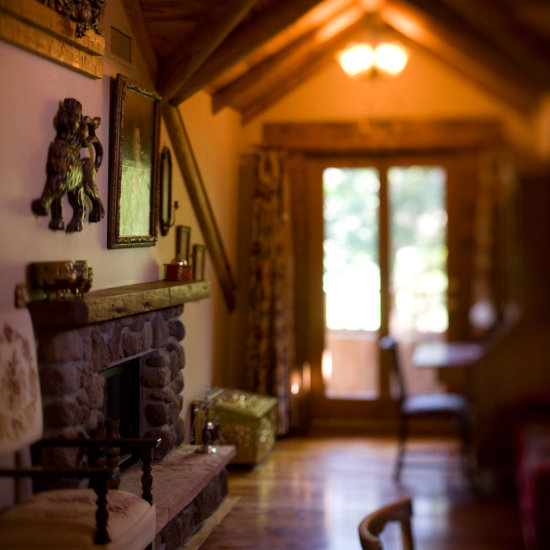 A view of a guest room fireplace