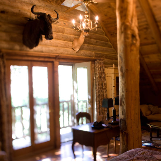 A view of a guest room desk and balcony