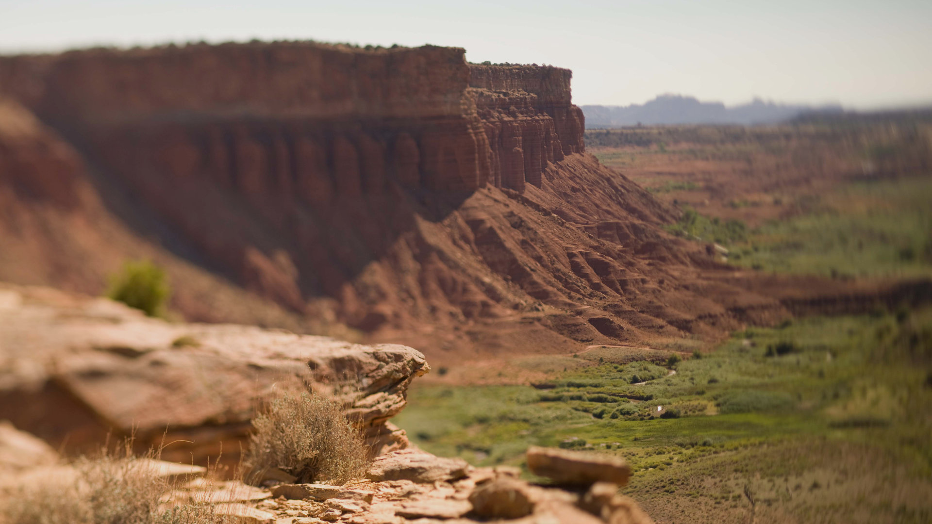 Fifth slide. A view of the red cliffs behind the Lodge