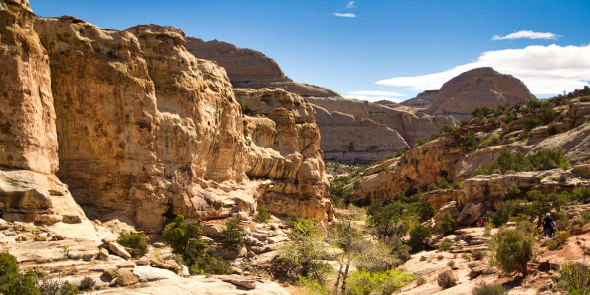People hike amoung the sandstone formations of Capitol Reef