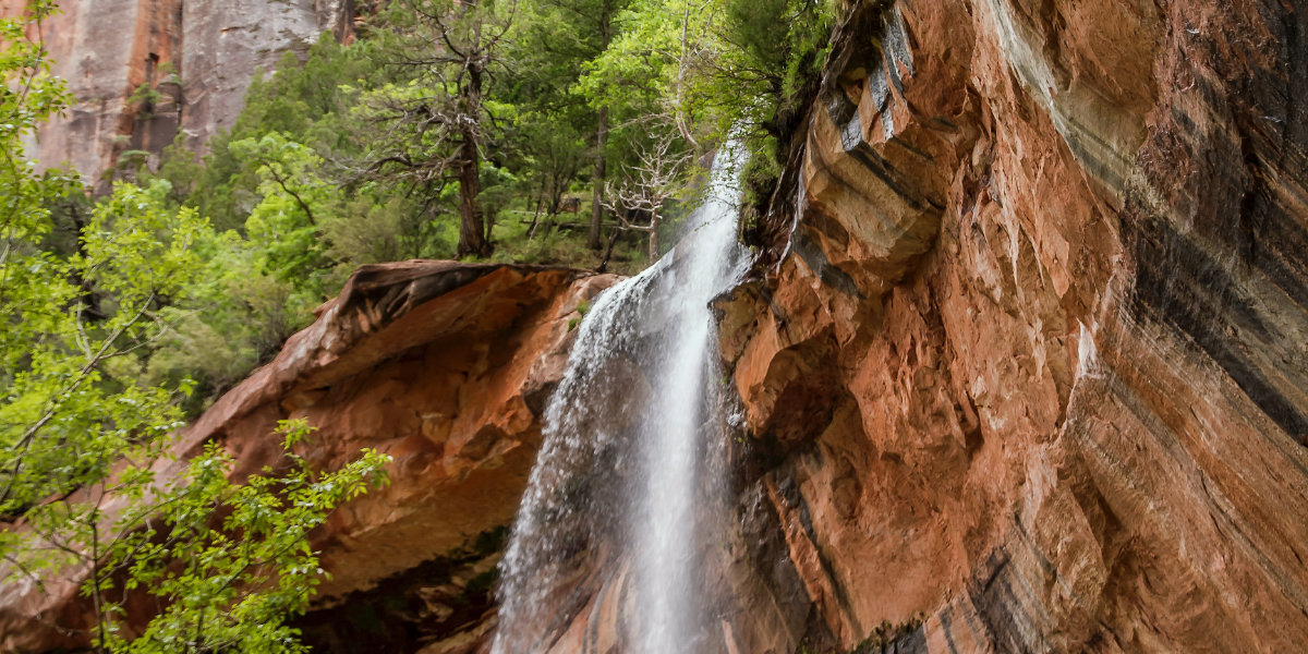 A waterfall cascades over a cliff