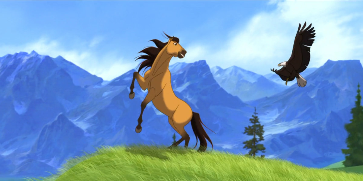 Spirit the animated horse running with an eagle over the grassy plains