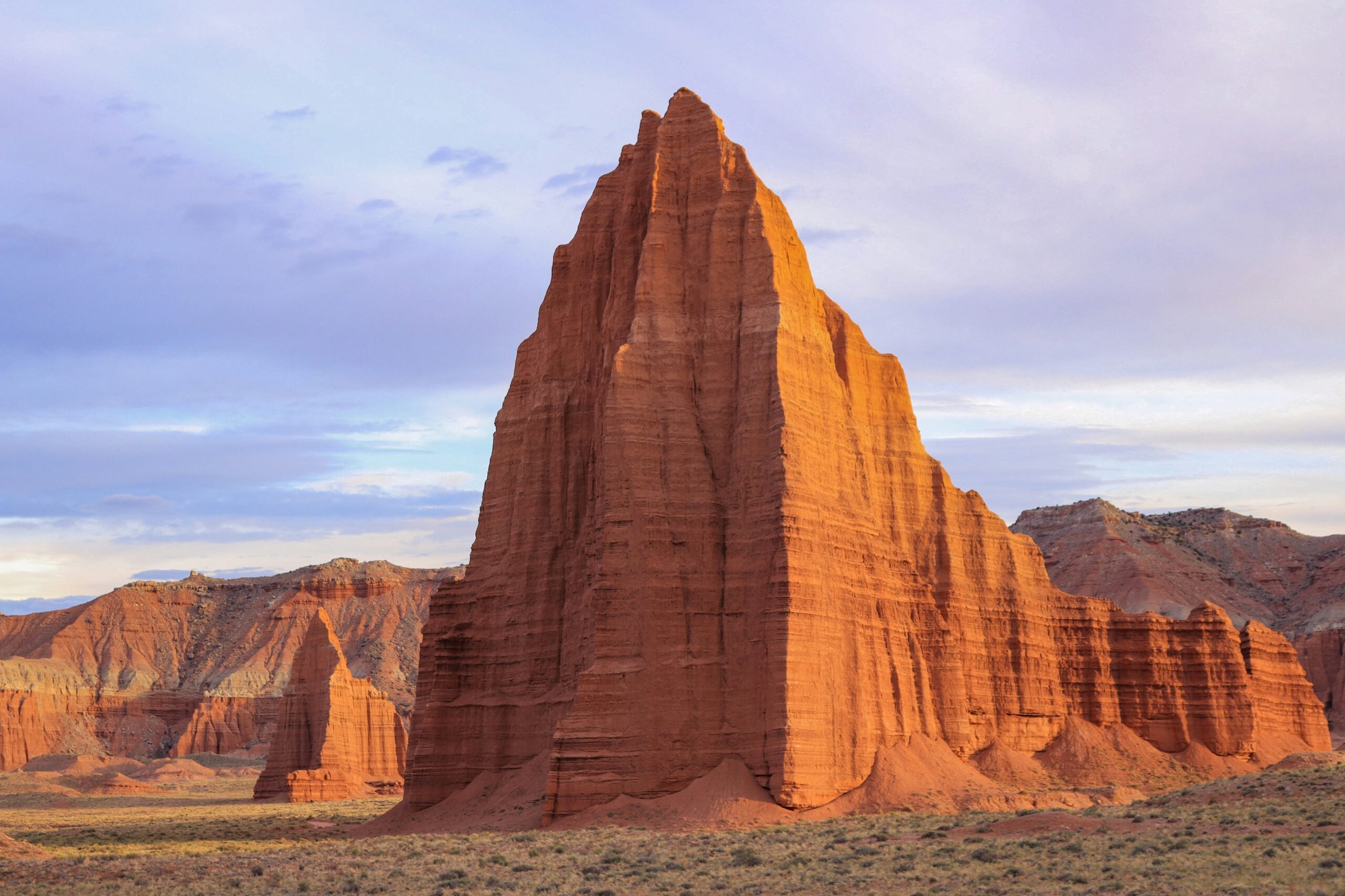 Temple of the Sun monolith standing alone on the desert floor in Cathedral Valley