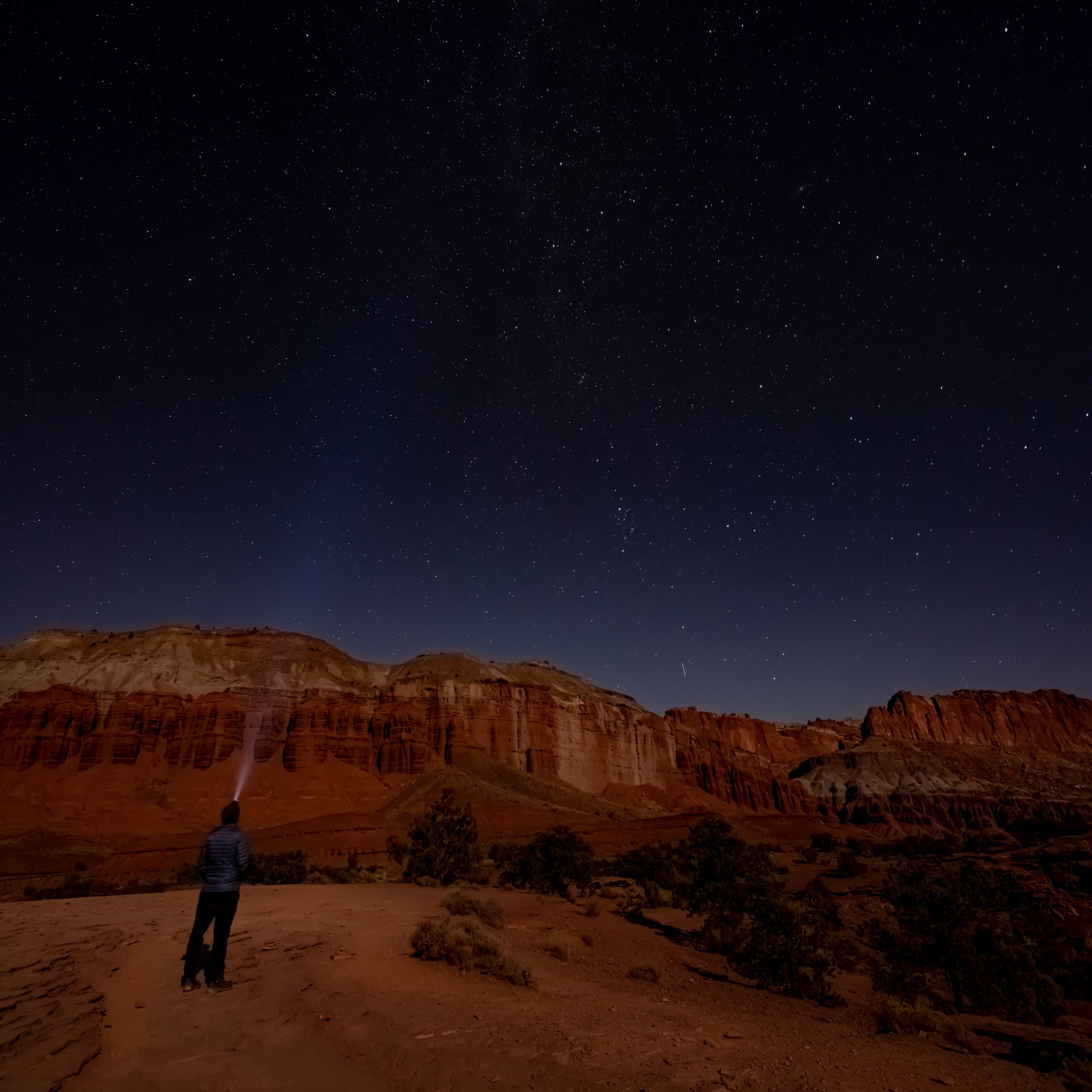 A dark night sky over red sandstone country in Southern Utah